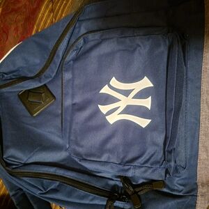 Blue Backpack with White Logo